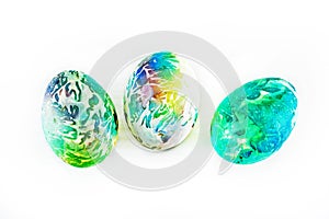 Â three colorful eggs on a white background